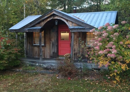 12x20 Weathered Gibraltar Cabin with painted red door