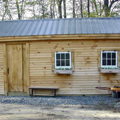 garage-clapboard-pine-siding-side-door-barn-sash-windows-flower-boxes-cute-car-storage-garden-shed