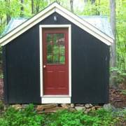 12x12 Fully-Assembled Custom Cross Gable Tiny House with red painted door