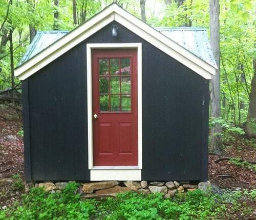 12x12 Fully-Assembled Custom Cross Gable Tiny House with red painted door