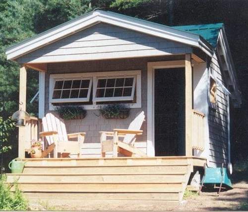 12x12 Potting Fort with cedar shingle siding, extra windows and custom staircase up to the porch