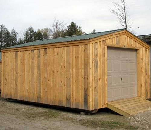 14x20 Barn Garage with evergreen metal roof, overhead door and pressure treated ramp.