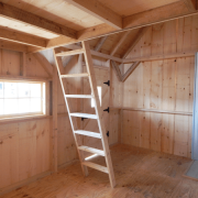 10x16 Harvester cabin interior with loft and ladder