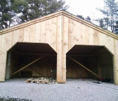 24x24 Simple Garage build in progress with rough sawn hemlock frame and pine board and batten siding