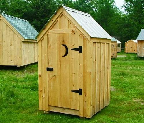 4x4 Outhouse Shed with metal roof, board and batten siding and door with moon cut-out