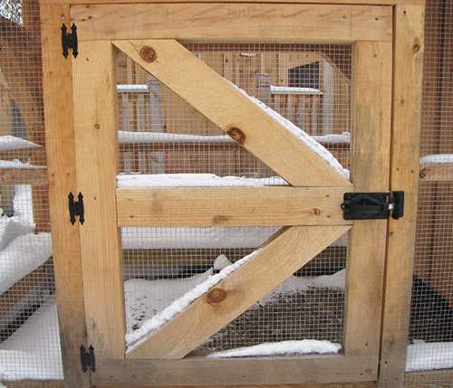 Side door constructed of pine and hardware cloth, fastening hardware included.
