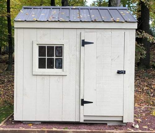6x8 Nantucket storage shed painted gray with a black metal roof