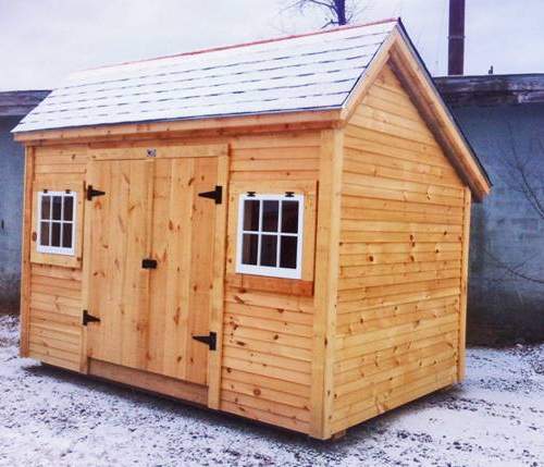 8x12 Church Street is a storage shed that includes two hinged barn sash windows and a set of double doors with a treated ramp