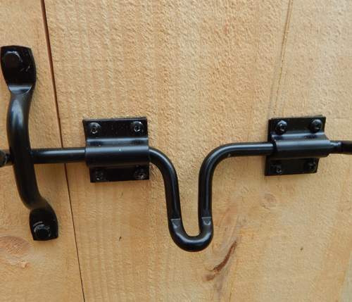 Heavy Duty Drop Latch installed on Barn Doors.  Steel and powder coated black.