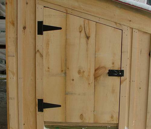 2-8 JCS Built 2" Thick Pine Single Angled Door on 5x10 Chicken Coop. Exterior view. Black Turn Latch.